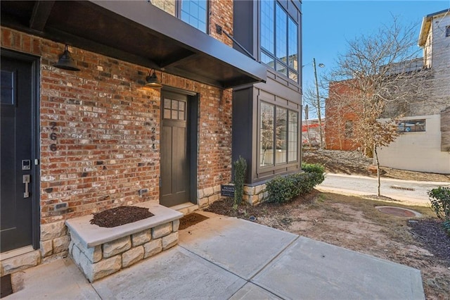 264 Castleberry Station Dr SW, Atlanta, GA 30313 - doorway to property featuring brick siding and a balcony