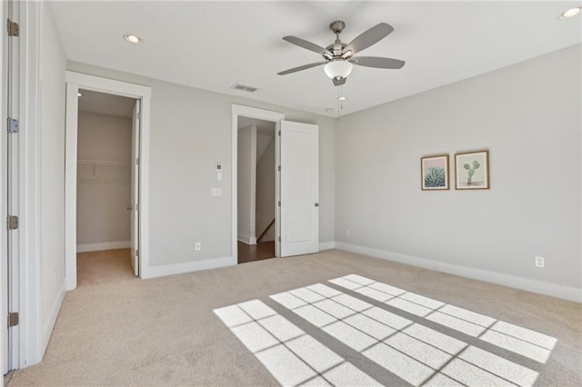 264 Castleberry Station Dr SW, Atlanta, GA 30313 - unfurnished bedroom featuring recessed lighting, a spacious closet, light carpet, ceiling fan, and baseboards