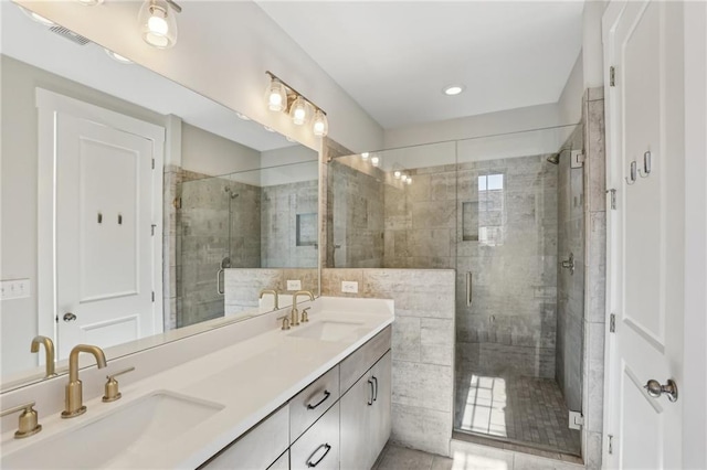 264 Castleberry Station Dr SW, Atlanta, GA 30313 - bathroom with a stall shower, visible vents, a sink, and double vanity