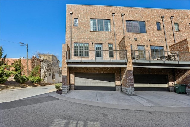 264 Castleberry Station Dr SW, Atlanta, GA 30313 - exterior space with an attached garage, concrete driveway, and brick siding