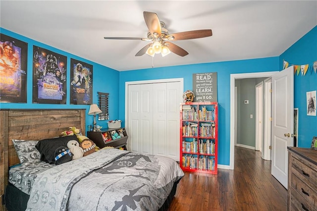 bedroom featuring a closet, a ceiling fan, baseboards, and wood finished floors