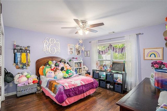 bedroom with visible vents, ceiling fan, and hardwood / wood-style flooring