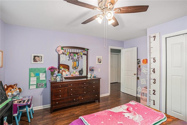 bedroom with baseboards, a ceiling fan, and wood finished floors