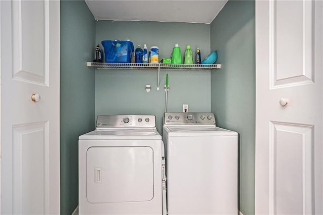 washroom featuring laundry area and washer and clothes dryer