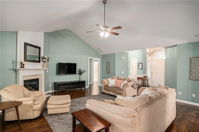 living area featuring ceiling fan, baseboards, lofted ceiling, and dark wood-type flooring
