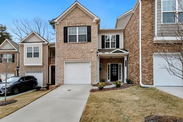 view of front of house featuring a garage and a front lawn