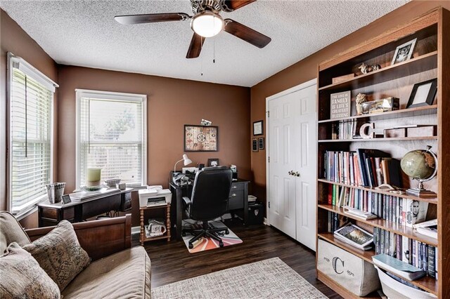 office space with a textured ceiling, a ceiling fan, and wood finished floors