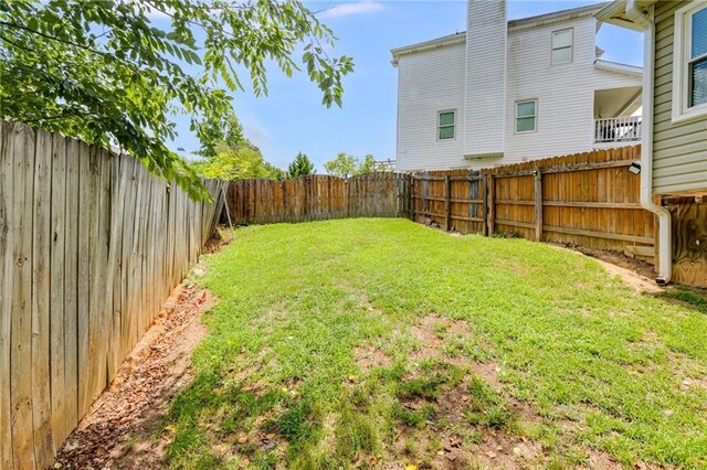 view of yard featuring a fenced backyard