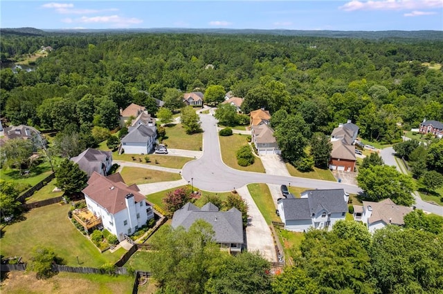 bird's eye view featuring a residential view and a view of trees