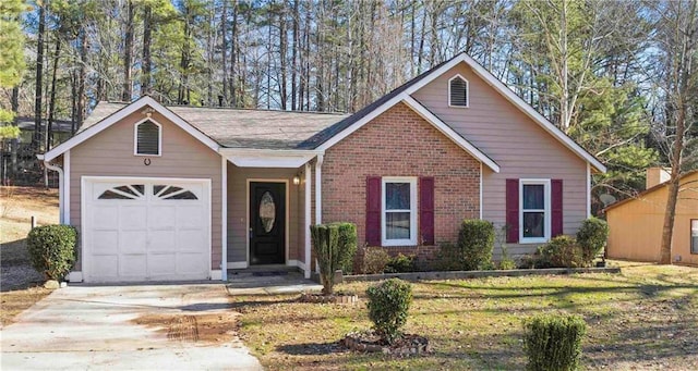 view of front of house with a garage and a front yard