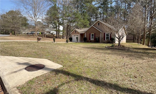 view of front of property featuring a front lawn and an attached garage