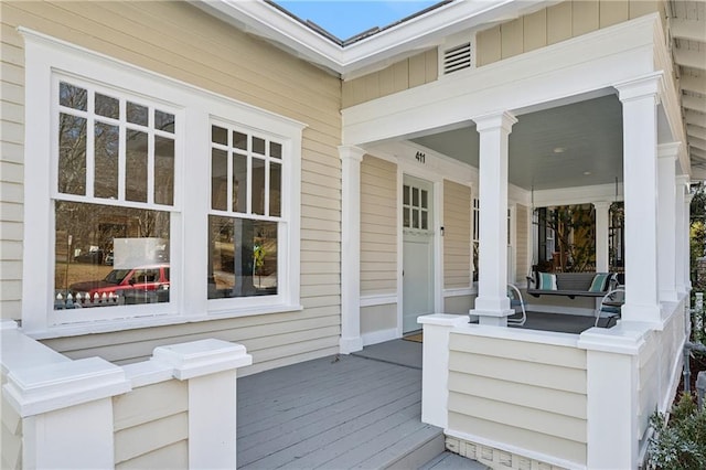 wooden terrace with a porch