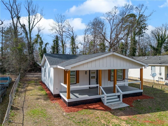 439 Bussey Ave, Thomson, GA 30824 - view of front of house featuring a shingled roof, a porch, and board and batten siding