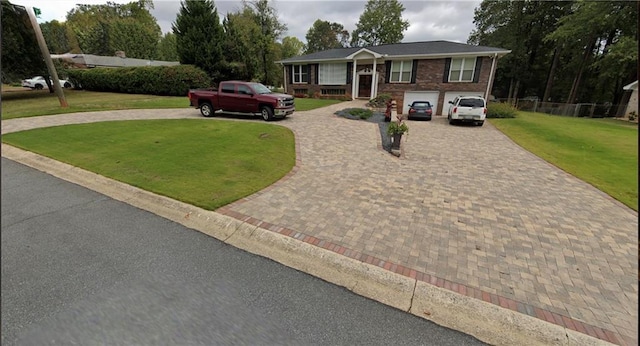 view of front facade featuring a garage and a front lawn