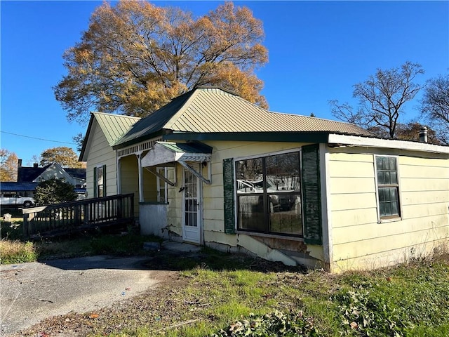 405 Magnolia St, La Fayette, GA 30728 - view of side of property featuring metal roof and a wooden deck