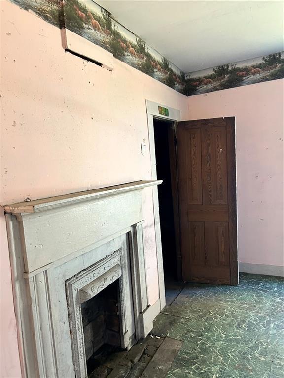 405 Magnolia St, La Fayette, GA 30728 - detailed view of a fireplace and baseboards