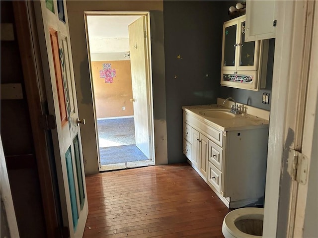 405 Magnolia St, La Fayette, GA 30728 - half bath with vanity, toilet, and hardwood / wood-style flooring