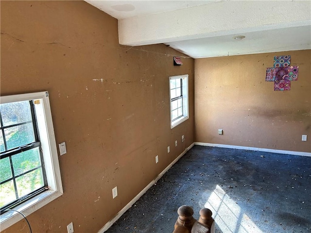 405 Magnolia St, La Fayette, GA 30728 - spare room featuring baseboards and beam ceiling