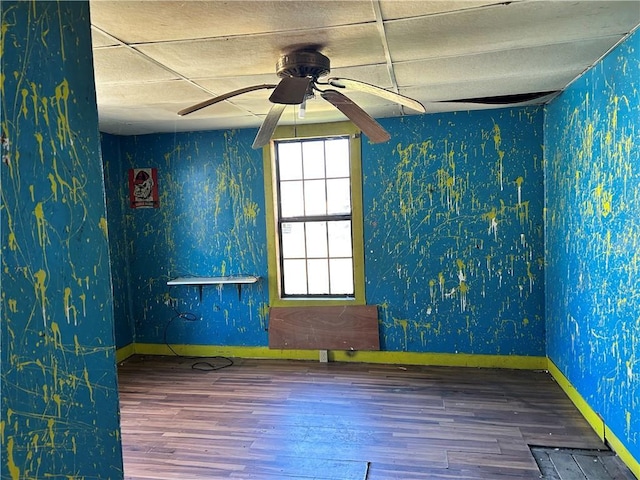 405 Magnolia St, La Fayette, GA 30728 - spare room with wallpapered walls, a ceiling fan, wood finished floors, and baseboards
