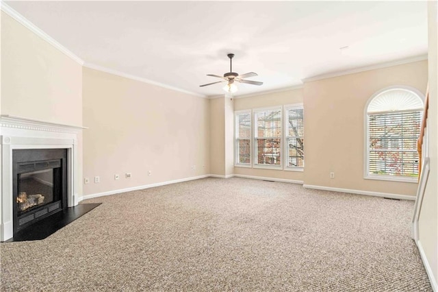 unfurnished living room featuring crown molding, ceiling fan, and carpet flooring