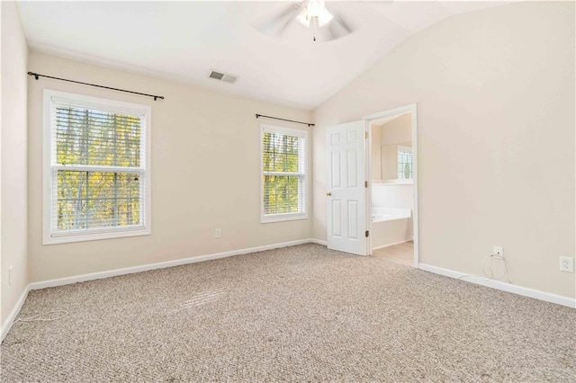 carpeted empty room with lofted ceiling and ceiling fan