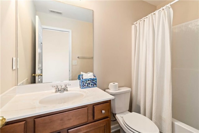 full bathroom with shower / bath combination with curtain, vanity, and toilet