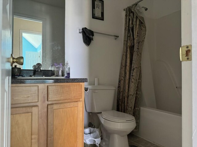 full bathroom featuring tile patterned flooring, shower / bathtub combination with curtain, toilet, and vanity