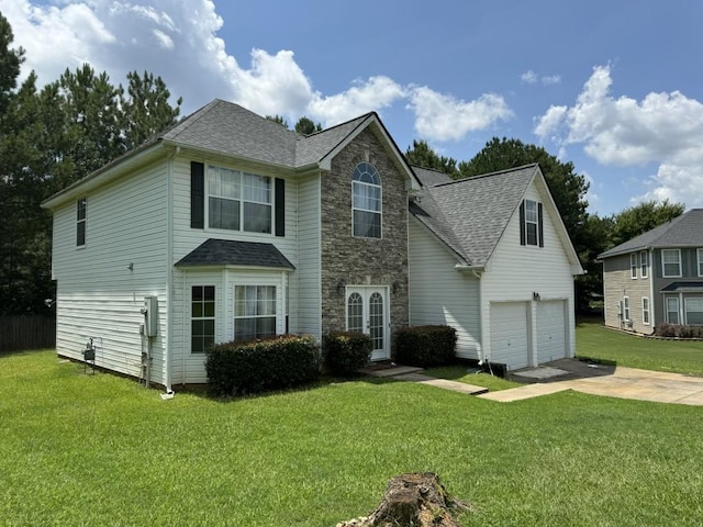 view of front of home with a garage and a front yard