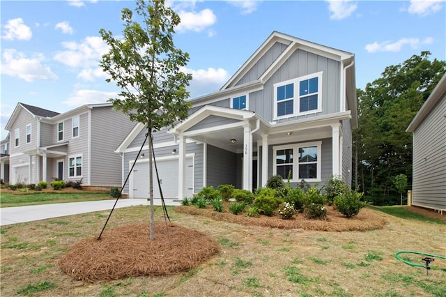 craftsman inspired home with a front yard and a garage