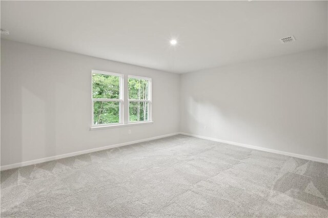 empty room with light colored carpet