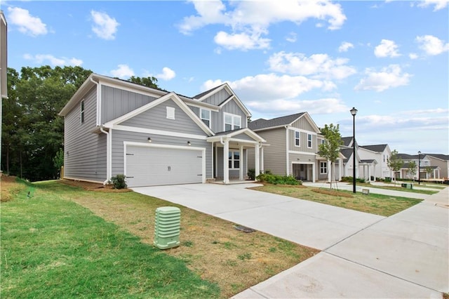 view of front of home featuring a front yard and a garage