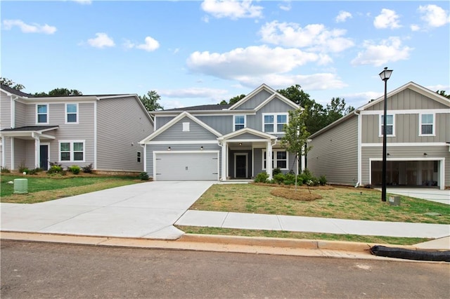 view of front of home with a garage and a front lawn