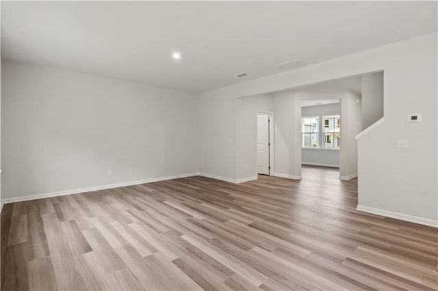 spare room featuring light wood-type flooring