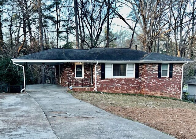 ranch-style house with a carport