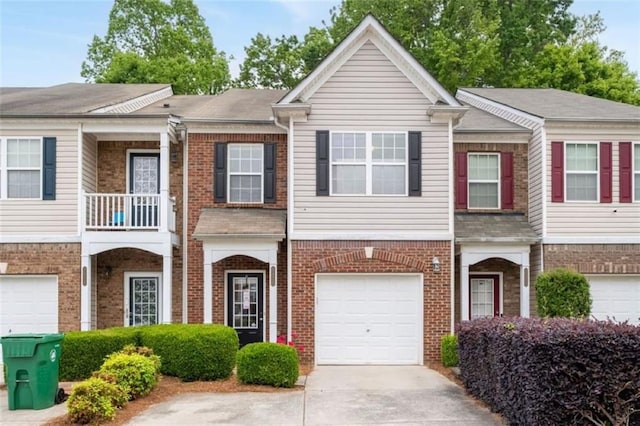 2826 Snapfinger Mnr, Decatur, GA 30035 - multi unit property with brick siding, a garage, a balcony, and concrete driveway
