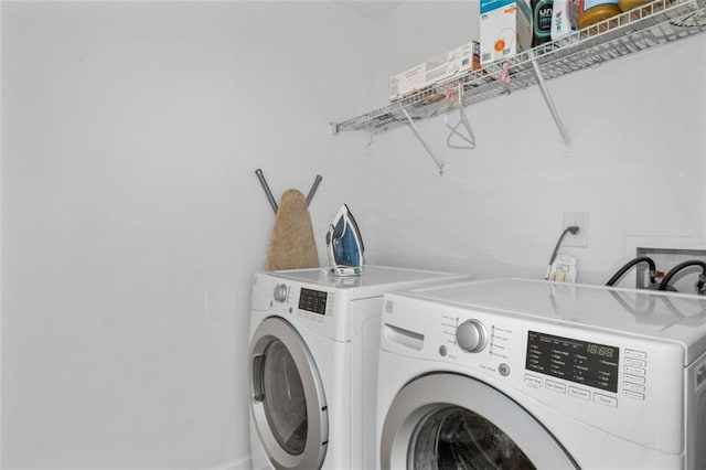 2826 Snapfinger Mnr, Decatur, GA 30035 - laundry room featuring separate washer and dryer and laundry area