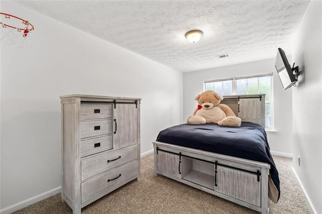 2826 Snapfinger Mnr, Decatur, GA 30035 - bedroom with carpet floors, a textured ceiling, baseboards, and visible vents