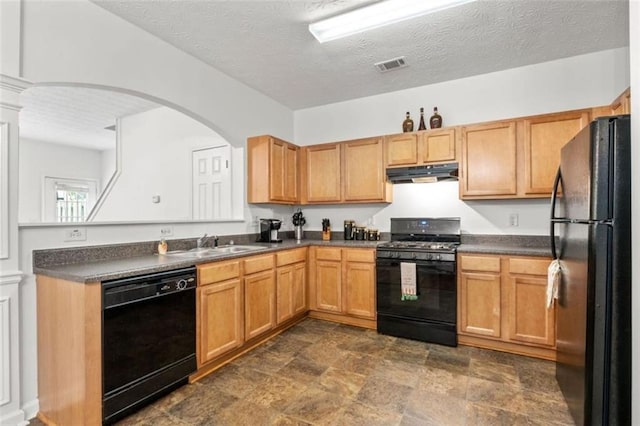 2826 Snapfinger Mnr, Decatur, GA 30035 - kitchen featuring dark countertops, a sink, under cabinet range hood, visible vents, and black appliances