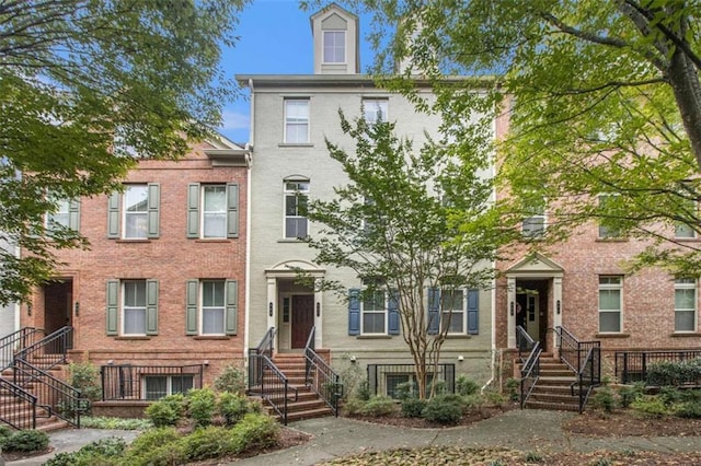 view of property with brick siding