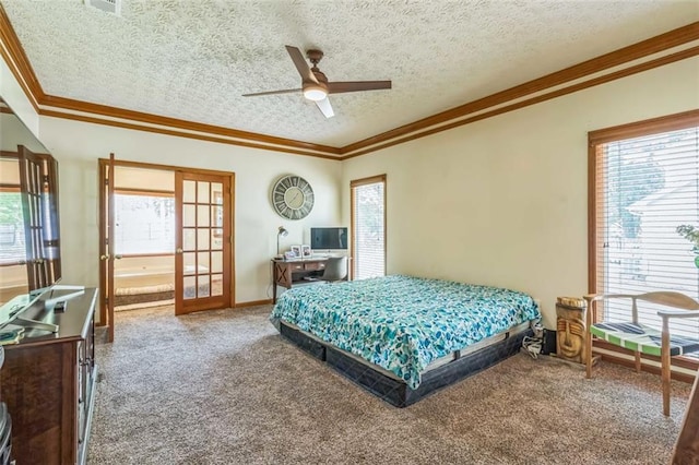 carpeted bedroom featuring ornamental molding, a textured ceiling, and multiple windows