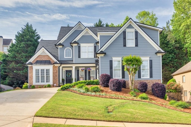 3125 Flatbottom Dr, Dacula, GA 30019 - craftsman-style home with a shingled roof, concrete driveway, stone siding, and a front yard