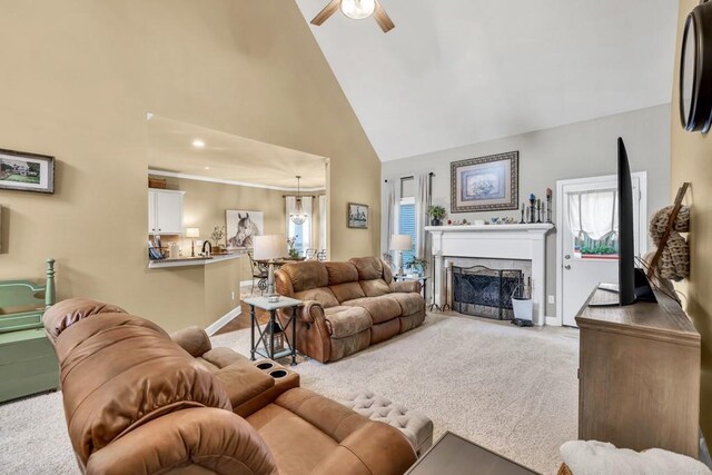 3125 Flatbottom Dr, Dacula, GA 30019 - living area with ceiling fan, light carpet, a fireplace, high vaulted ceiling, and baseboards