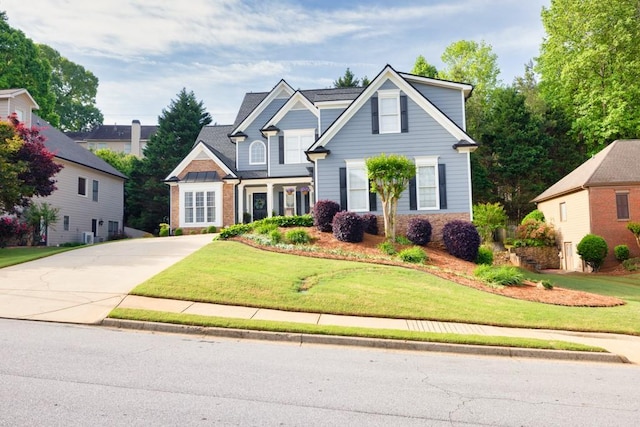 3125 Flatbottom Dr, Dacula, GA 30019 - view of front of home featuring stone siding, driveway, and a front yard