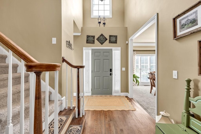 3125 Flatbottom Dr, Dacula, GA 30019 - entrance foyer with stairway, plenty of natural light, wood finished floors, and a towering ceiling