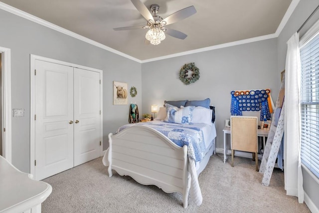 3125 Flatbottom Dr, Dacula, GA 30019 - carpeted bedroom featuring a ceiling fan, baseboards, ornamental molding, and a closet