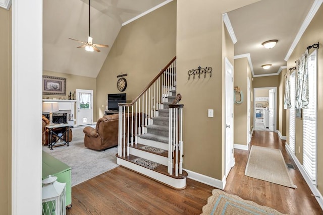 3125 Flatbottom Dr, Dacula, GA 30019 - staircase with baseboards, a ceiling fan, wood finished floors, and a fireplace