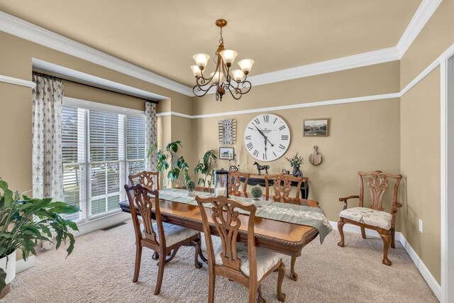3125 Flatbottom Dr, Dacula, GA 30019 - carpeted dining space featuring visible vents, ornamental molding, baseboards, and a notable chandelier
