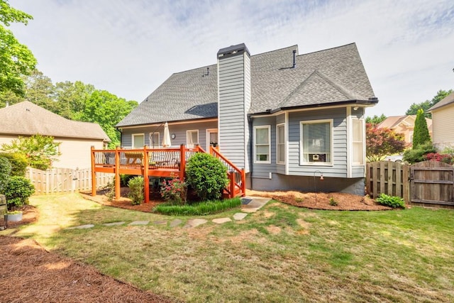 3125 Flatbottom Dr, Dacula, GA 30019 - back of house with a lawn, a fenced backyard, roof with shingles, and a deck