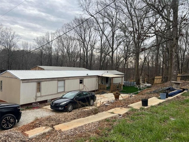 view of side of home featuring metal roof