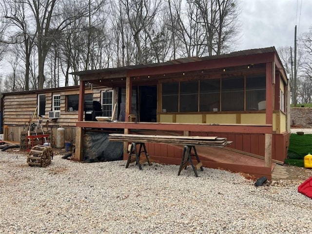 rear view of property featuring cooling unit